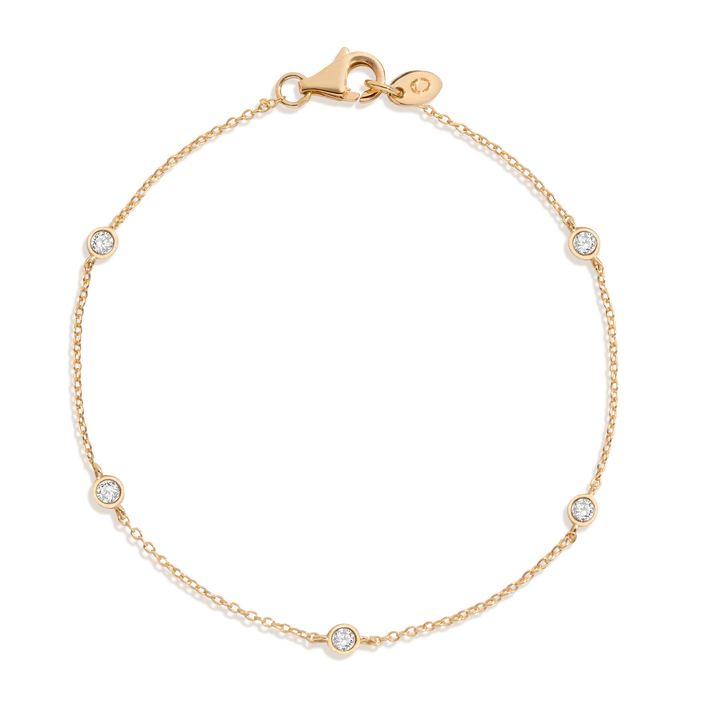 Qasr station bracelet, a fine 18k gold chain with bezel-set diamonds